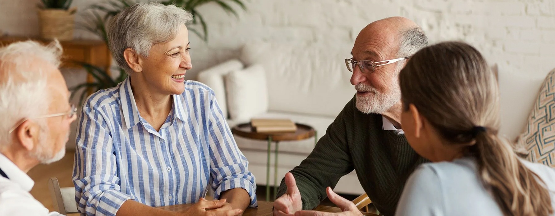 group of 55+ adults playing cards