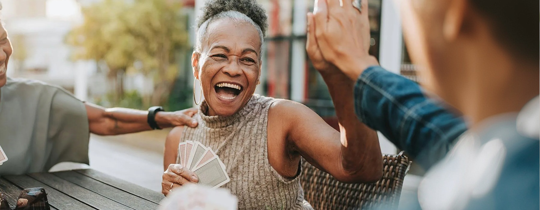 adults playing cards and having a good time