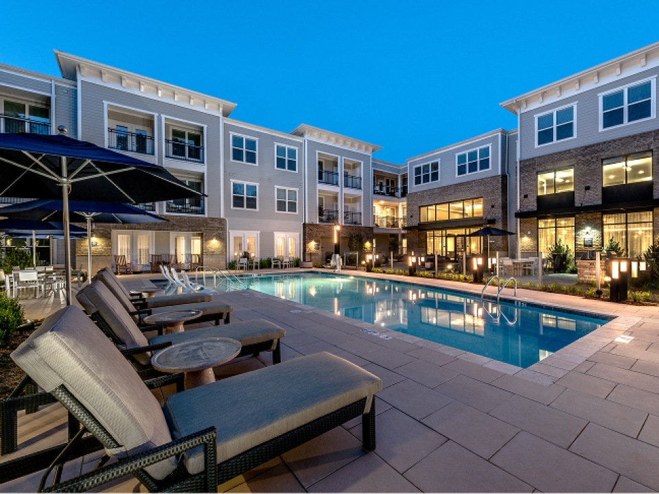 evening time around pool with outdoor lighting